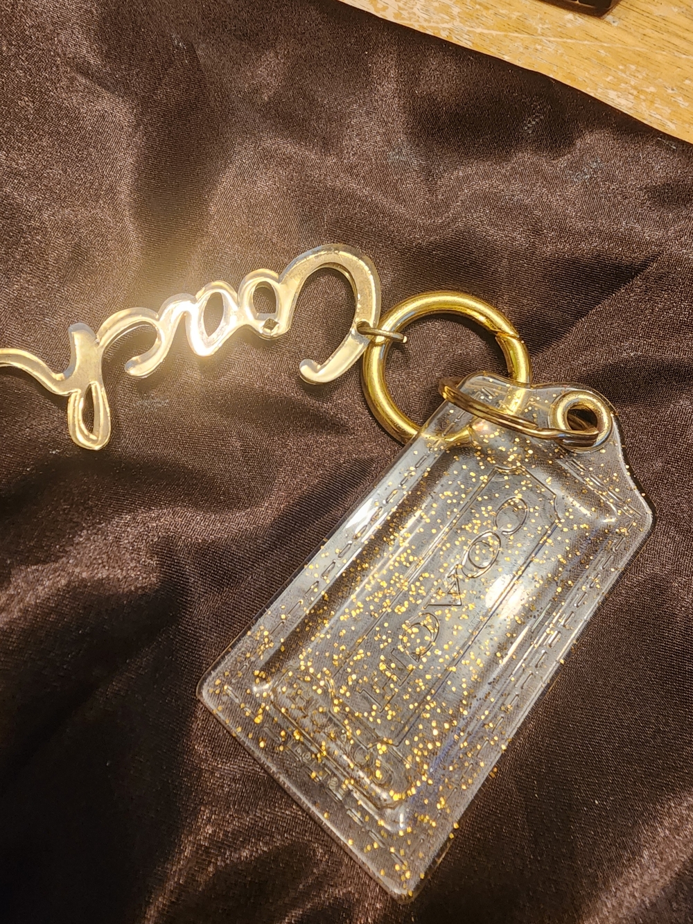 vintage Coach Poppy clear acrylic and gold-glitter script logo bag charm keychai